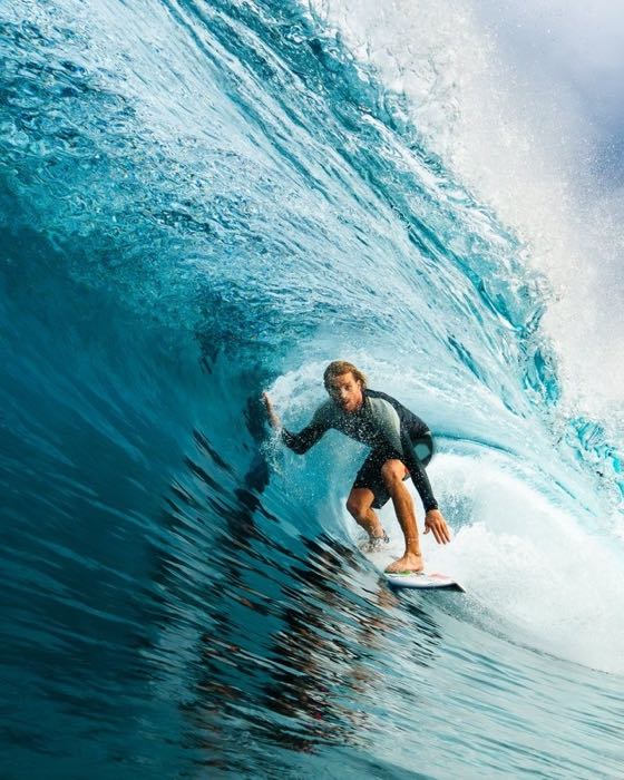 Surfer inside a breaking wave