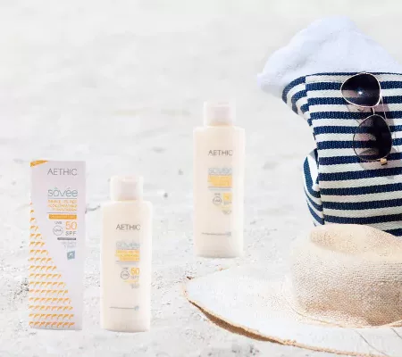 Aethic SPF 50 sunscreen displayed on beach