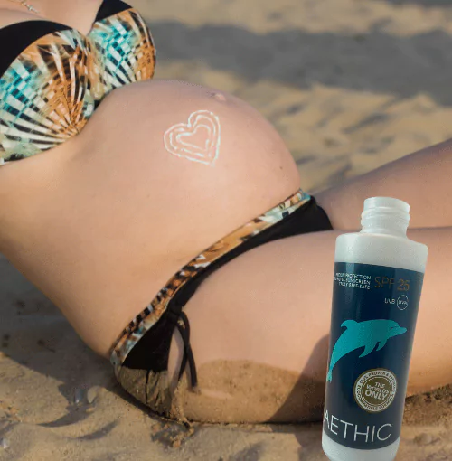 pregnant woman on beach with Aethic sunscreen